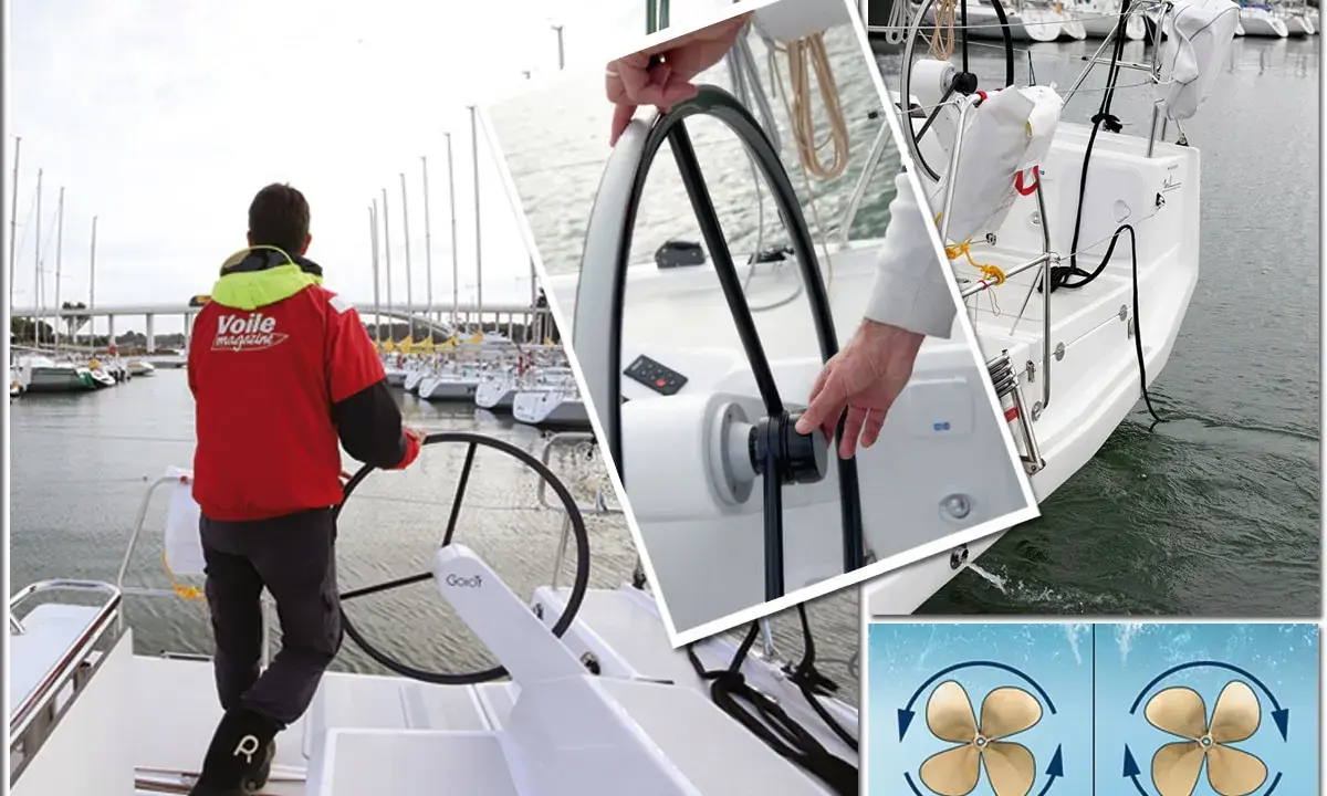 Un homme en blouson rouge au port, prêt à abattre voile. Gros plan sur la barre et les hélices du voilier.