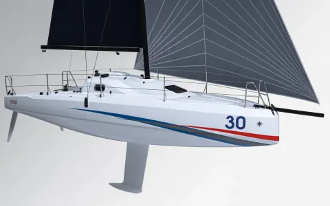 Voilier blanc Sun Fast 30 OD avec grand voile grise, prêt à fendre les vagues.