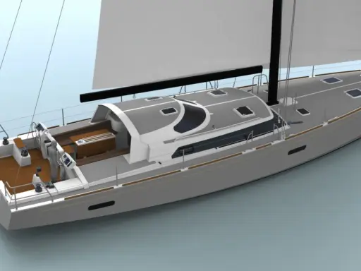 Voilier Boreal 70 moderne, avec une coque grise, un pont en teck et des voiles blanches déployées.