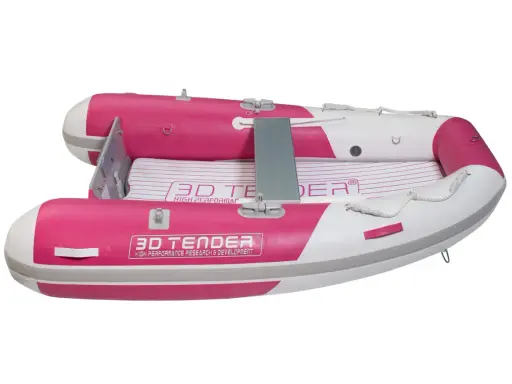 Un petit bateau gonflable rose et blanc, parfait pour rejoindre un grand bateau.